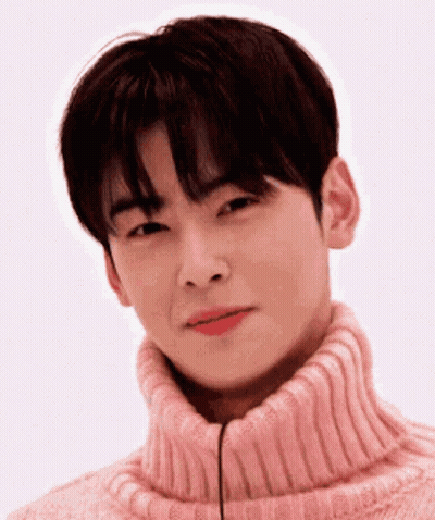 Young Man In Pink Turtleneck Smiling GIF