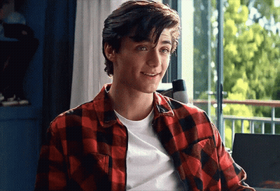 Young Man In Plaid And White Shirt Smiling GIF