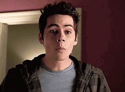 Young Man In Plaid Hoodie And Blue Shirt GIF