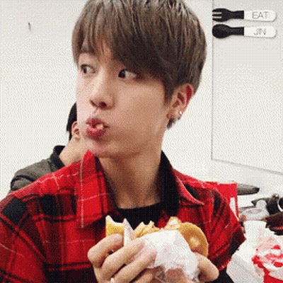 Young Man In Plaid Shirt Eating Hamburger GIF