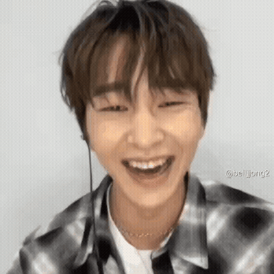 Young Man In Plaid Shirt Laughing GIF