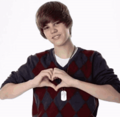 Young Man In Plaid Sweater Making Heart GIF