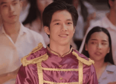 Young Man In Purple And Gold Uniform Before Crowd GIF