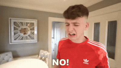 Young Man In Red Adidas Shirt Making A Face GIF