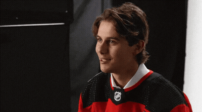 Young Man In Red And Black NHL Jersey GIF