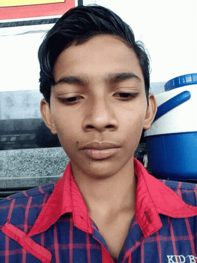 Young Man In Red And Blue Plaid Shirt With KDB On Sleeve GIF
