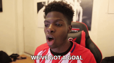 Young Man In Red And White Shirt Saying Goal GIF