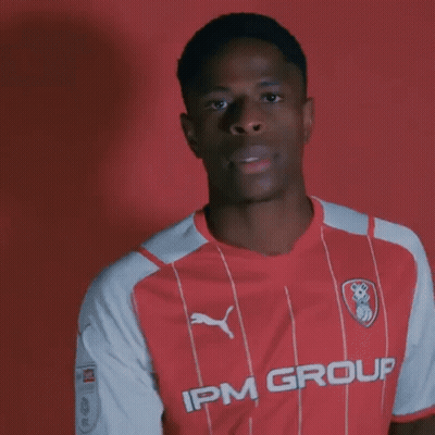 Young Man In Red And White Striped IPM Group Shirt GIF