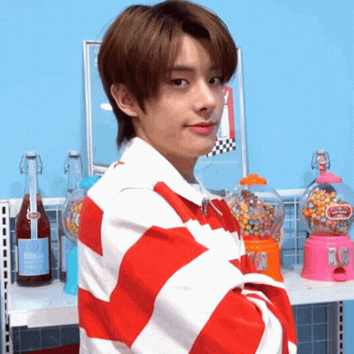 Young Man In Red And White Striped Shirt At Gumball Machine GIF