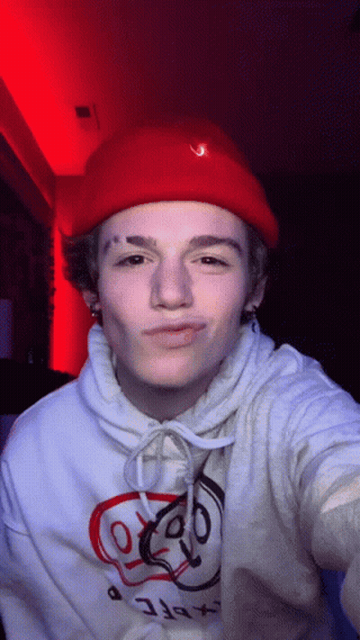 Young Man In Red Hat And White Hoodie GIF