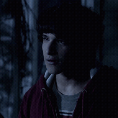 Young Man In Red Hoodie And Striped Shirt GIF