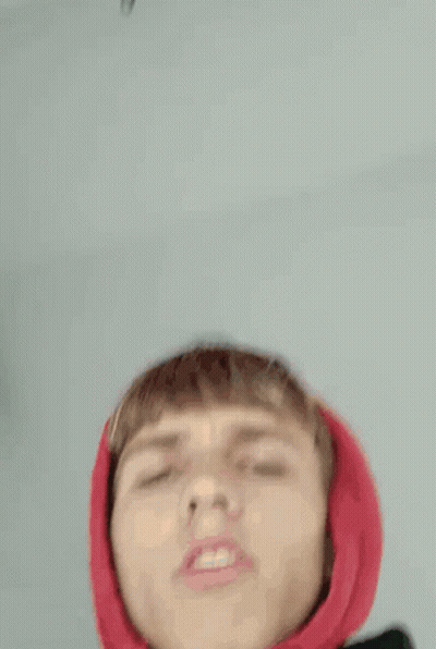 Young Man In Red Hoodie Making Funny Face GIF
