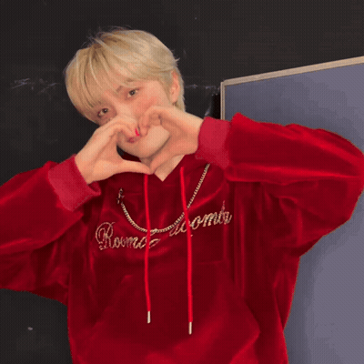 Young Man in Red Hoodie Making Heart With Hands