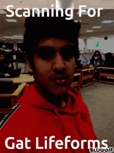 Young Man In Red Hoodie Scanning For Gat Life Forms GIF