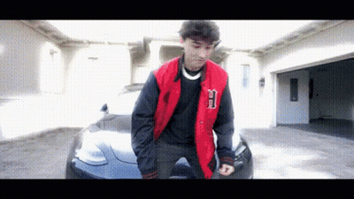 Young Man In Red Jacket With Letter B GIF
