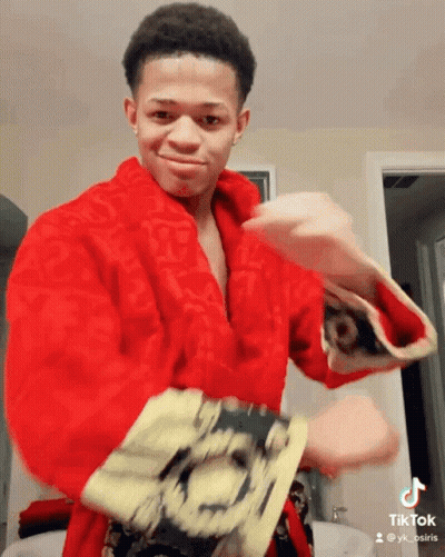 Young Man In Red Robe With TikTok Account GIF
