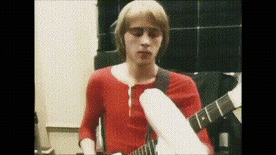 Young Man In Red Shirt Playing White Guitar GIF