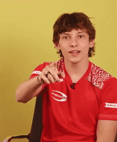 Young Man In Red Shirt Pointing GIF
