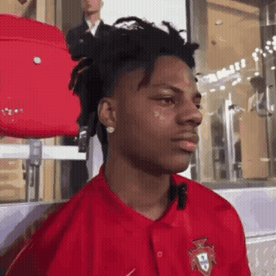 Young Man In Red Shirt With Portugal Badge GIF