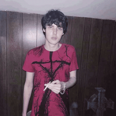 Young Man In Red Shirt With Tree Smoking Cigarette GIF