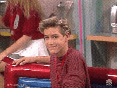 Young Man In Red Sweater Sitting In Diner GIF
