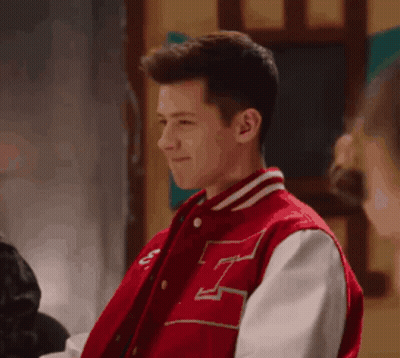 Young Man in Red Varsity Jacket With Letter H
