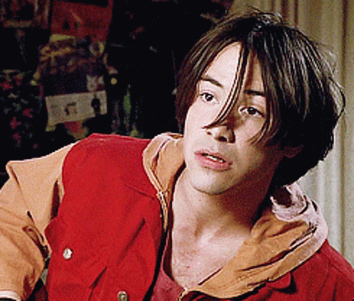 Young Man In Red Vest And Tan Shirt GIF
