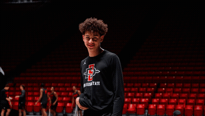 Young Man In San Diego State Shirt By Basketball Hoop GIF