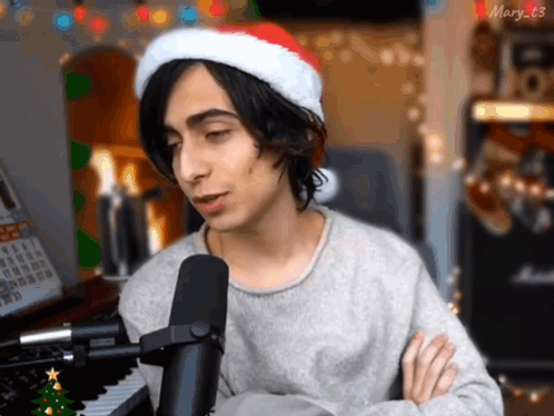 Young Man In Santa Hat Singing GIF