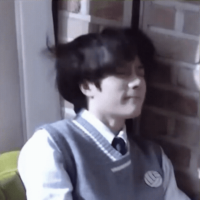Young Man In School Uniform Making Funny Face GIF