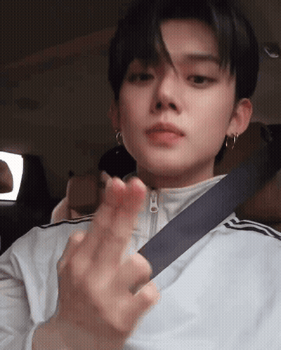 Young Man In Seat Belt Making Heart Shape GIF