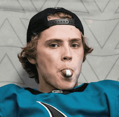 Young Man In Sharks Jersey And Black Hat GIF