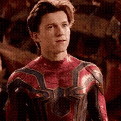 Young Man In Spiderman Suit Looking At Camera GIF