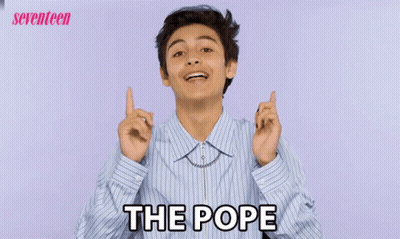Young Man In Striped Shirt Pointing At Camera Saying The Pope GIF
