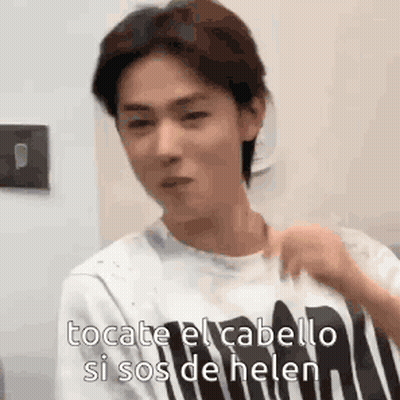 Young Man In Striped Shirt Talking Spanish GIF