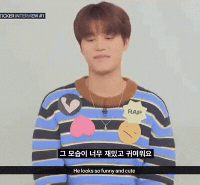 Young Man In Striped Sweater And Necklace Talking Foreign Language GIF