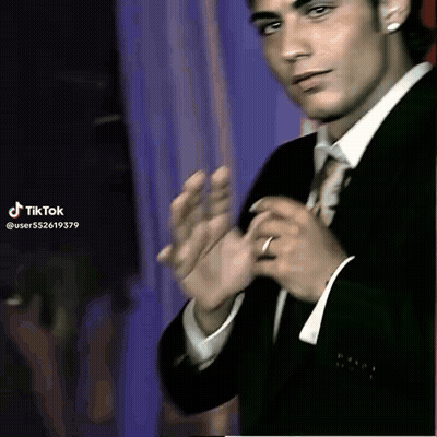 Young Man In Suit And Tie Clapping GIF