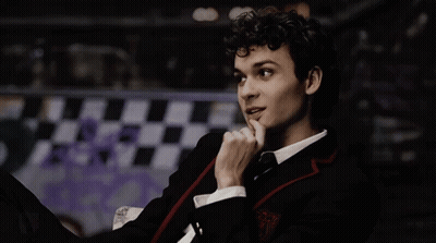 Young Man In Suit And Tie Finger On Chin GIF