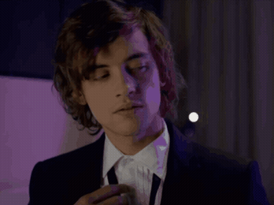 Young Man In Suit And Tie Looking GIF