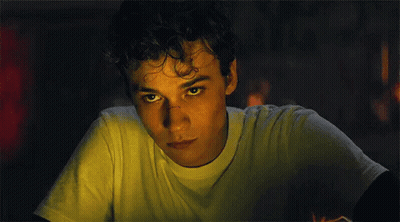 Young Man In Suit And Tie Looking Up GIF