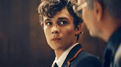 Young Man In Suit And Tie Next To Another Man GIF