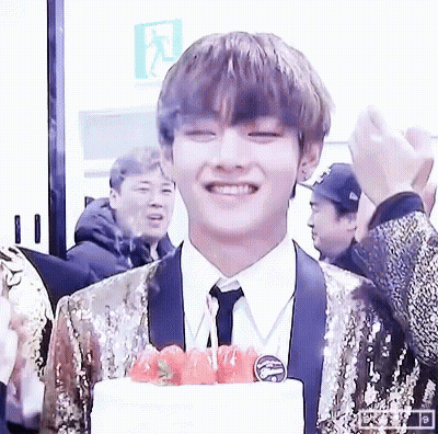 Young Man In Suit Smiling With Cake And Strawberries GIF