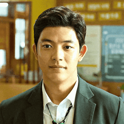 Young Man In Suit Tie Looking At Camera GIF