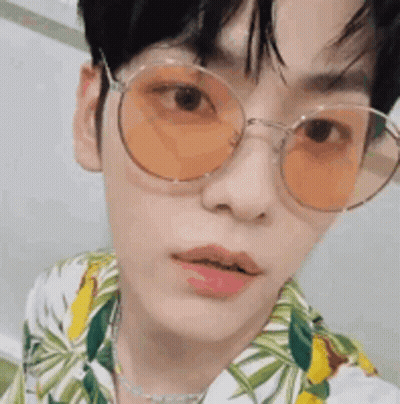 Young Man In Sunglasses And Floral Shirt GIF