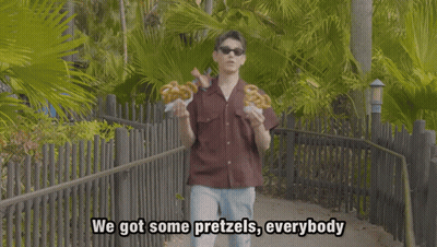 Young Man In Sunglasses Holding Pretzels Saying Got Some Pretzels GIF