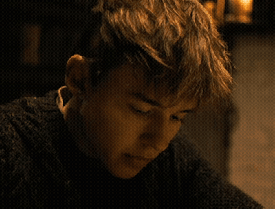 Young Man In Sweater Close Up GIF