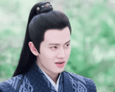 Young Man In Traditional Costume With Long Black Ponytail GIF
