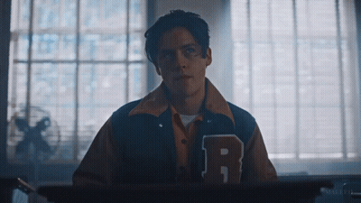Young Man In Varsity Jacket With Letter R GIF