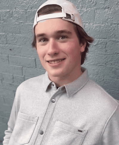 Young Man In White Baseball Cap And Grey Shirt GIF
