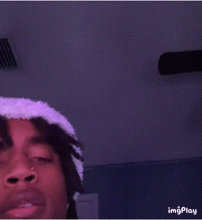 Young Man In White Hat And Purple Shirt Taking Selfie GIF